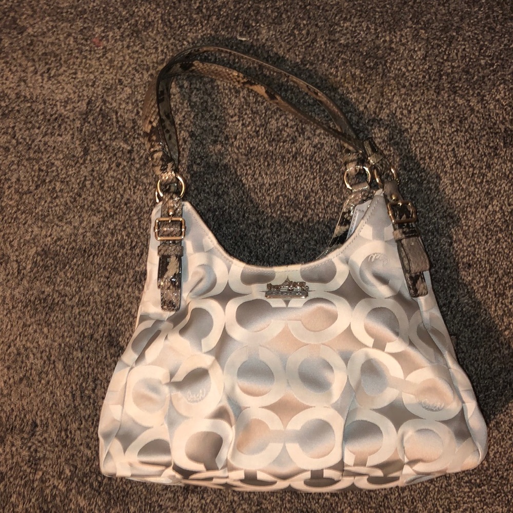 Medium sized three compartment coach purse